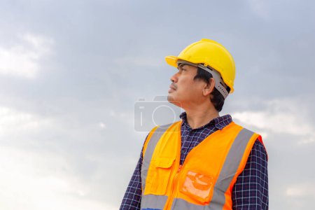 Photo for Portrait of Foreman worker in hardhat at the infrastructure construction site, Construction engineer at the building site - Royalty Free Image