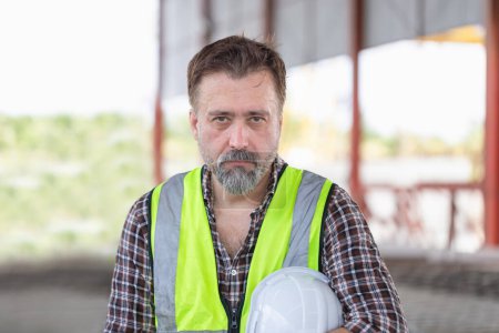 Photo for Portrait of caucasian man at the precast factory site, Senior engineer man at the construction sit - Royalty Free Image