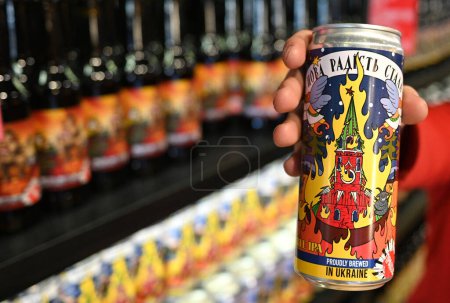 Photo for Lviv, Ukraine - December 19, 2022: A can of a localy brewed beer which with label depicting a burning Moscow Kremlin. - Royalty Free Image