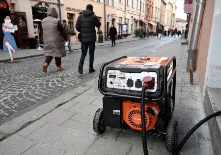 Photo for Lviv, Ukraine - Dec 29, 2022: A electricity generator outside a store during a power outage following Russian missile strikes. - Royalty Free Image