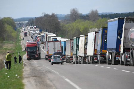Photo for Lviv region, Ukraine - April 18, 2023: A long line of trucks near the Rava-Ruska border checkpoint on the Ukrainian-Polish border. - Royalty Free Image
