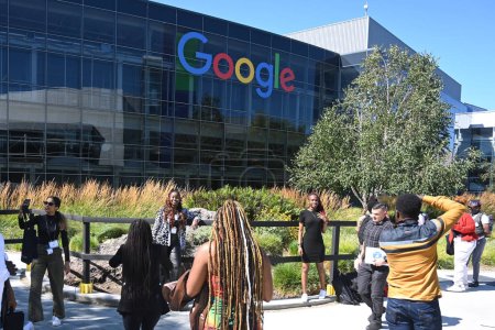 Photo for Mountain View, CA, USA - July 28, 2023: People near the Googleplex  headquarters complex of Google and its parent company at 1600 Amphitheatre Parkway in Mountain View. - Royalty Free Image