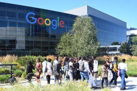 Photo for Mountain View, CA, USA - July 28, 2023: People near the Googleplex  headquarters complex of Google and its parent company at 1600 Amphitheatre Parkway in Mountain View. - Royalty Free Image