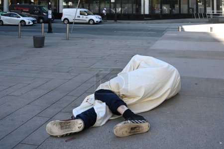 Photo for Vancouver, BC, Canada - August 16, 2023: A homeless man sleep on the street indowntown of Vancouver. - Royalty Free Image