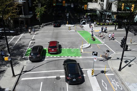 Photo for Vancouver, BC, Canada - August 15, 2023: Top view at the cars go through the intersection in Vancouver. - Royalty Free Image