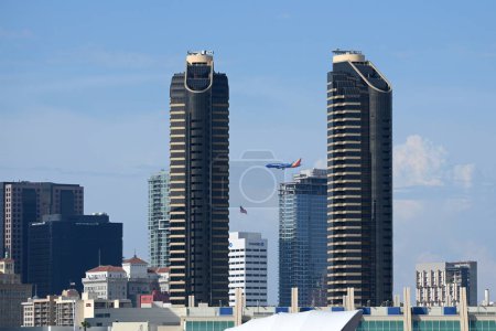 Photo for San Diego, CA, USA - July 31, 2023: The Southwest Airlines plane flies by Downtown San Diego. - Royalty Free Image