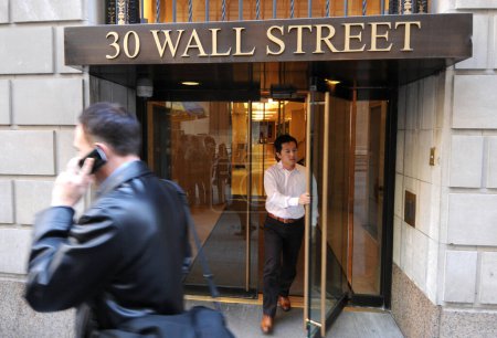 Photo for NEW YORK, USA - NOV 07, 2011. A man with mobile phone at a Wall Street, Manhattan, NYC - Royalty Free Image