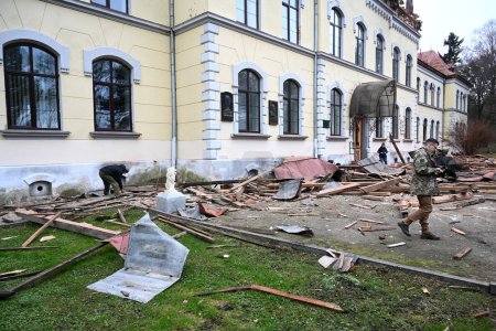 Photo for Lviv, Ukraine - January 1, 2024: People outside the damaged Lviv National University of Nature Management, after a Russian drone attack in Lviv. - Royalty Free Image