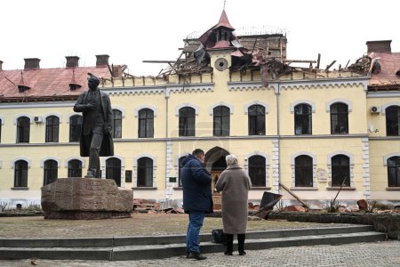 Photo for Lviv, Ukraine - January 1, 2024: People outside the damaged Lviv National University of Nature Management, after a Russian drone attack in Lviv. - Royalty Free Image