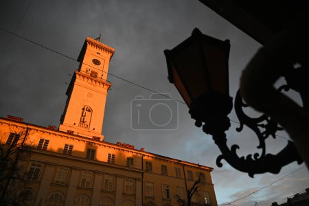 Photo for Lviv City Hall Tower at sunset light in city of Lviv, Ukraine - Royalty Free Image