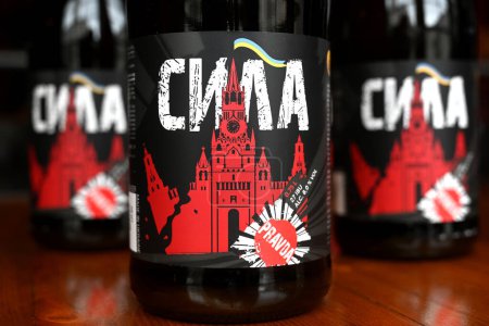 Photo for Lviv, Ukraine - April 2, 2024: A botles of localy brewed beer called Power with label depicting a destroyed Moscow Kremlin with flag of Ukraine. - Royalty Free Image