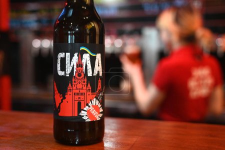 Photo for Lviv, Ukraine - April 2, 2024: A botles of localy brewed beer called Power with label depicting a destroyed Moscow Kremlin with flag of Ukraine. - Royalty Free Image