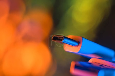 Photo for Close up view of USB -C connector with colorful glitter background. - Royalty Free Image