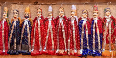 Photo for Panoramic view of colorful several Rajasthan style puppets for sale in Jaisalmer, India. - Royalty Free Image