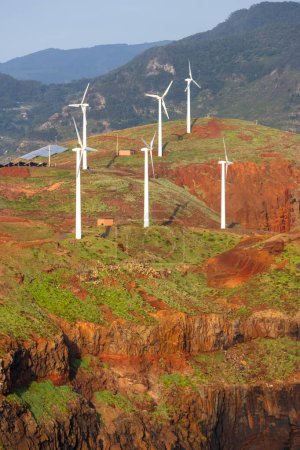 Téléchargez les photos : Wind mills in the hill top at Madeira island , Portugal. Concept of renewable energy. - en image libre de droit