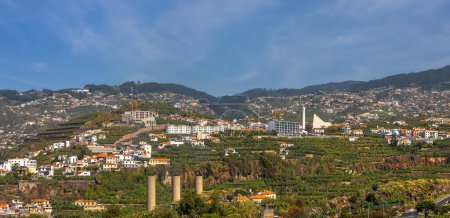 Panoramic aerial view of Scenic Funchal city suburbs during sunny day in Madeira Island, Portugal.