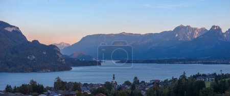 Panoramic view of scenic landscape of Wolfgangsee and St Gilgen town in Austria during twilight.