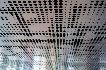 Modern building metal ceiling with round perforations