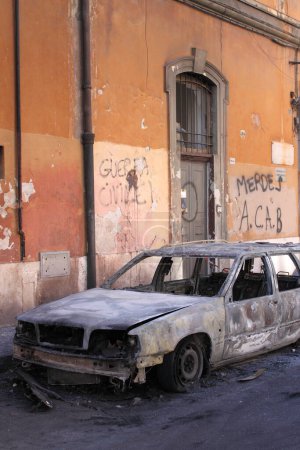 Photo for ROME - October 15: Devastation of cars by black block groups during the Indignatos demostrations on October 15, 2011 in Rome, Italy - Royalty Free Image