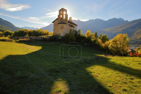Photo for The chapel of Villard Saint Pancrace, located on a hill near Briancon, Hautes Alpes (French Southern Alps), France, surrounded by Autumn colors - Royalty Free Image