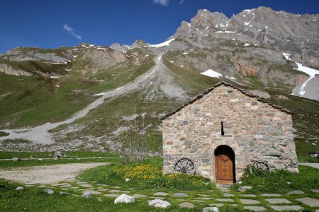 Photo for A chapel surrounded by mountains, located next to Roc de la Peche hut along the Chaviere valley, Pralognan la Vanoise,Vanoise National Park, Northern French Alps, Tarentaise, Savoie, France - Royalty Free Image