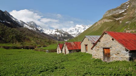 Photo for The hamlet Montaimont, with traditional stone houses, located along the Chaviere valley above Pralognan la Vanoise,Vanoise National Park, Northern French Alps, Tarentaise, Savoie, France - Royalty Free Image