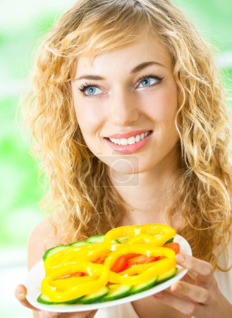 Photo for Portrait of happy smiling beautiful blond woman with salad - Royalty Free Image