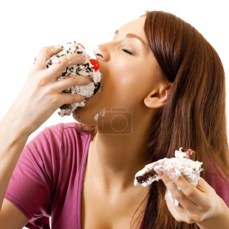 Foto de Mujer alegre comiendo pastel, aislado sobre fondo blanco - Imagen libre de derechos