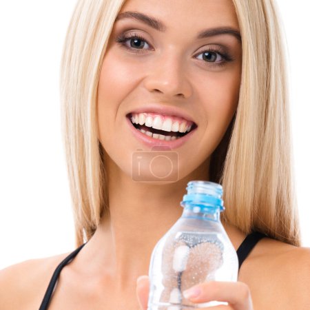 Photo for Happy smiling young woman in sportswear with water, isolated over white background. Female fitness instructor or personal trainer at studio shot. Health, beauty and fitness concept. - Royalty Free Image