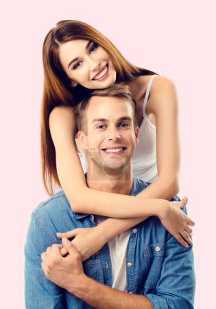Photo for Portrait of young couple, close to each other and looking at camera with smile. Caucasian models in love, relationship, dating, flirting, lovers, romantic concept. - Royalty Free Image