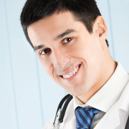 Photo for Happy smiling young doctor at office - Royalty Free Image