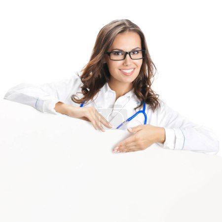Photo for Portrait of happy smiling young female doctor showing blank signboard, isolated over white background - Royalty Free Image