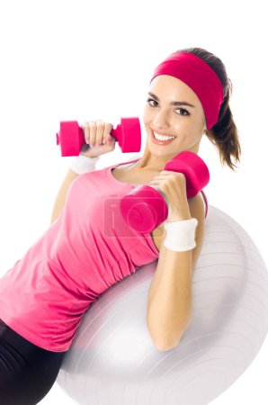 Foto de Joven mujer feliz en ropa deportiva roja haciendo ejercicio de fitness, aislado en blanco - Imagen libre de derechos