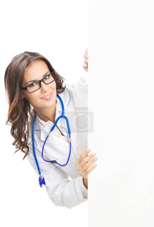 Photo for Portrait of happy smiling young female doctor showing blank signboard, isolated over white background - Royalty Free Image