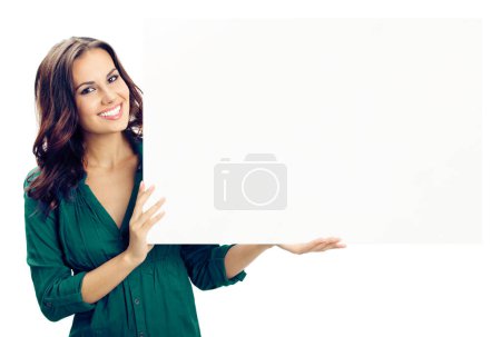 Photo for Happy smiling young woman showing blank signboard or copyspace for advertise, slogan or text, isolated against white background - Royalty Free Image