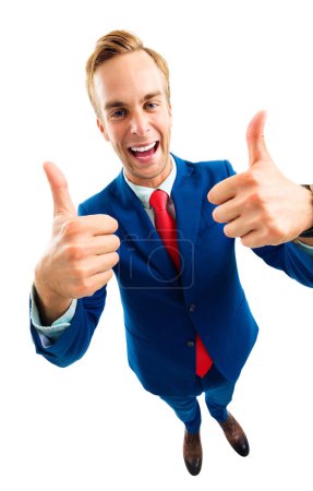 Foto de Retrato de cuerpo completo de empresario divertido en traje de confianza azul y corbata roja, mostrando el gesto hacia arriba pulgares, ángulo superior vista disparo, aislado contra fondo blanco. Concepto empresarial. - Imagen libre de derechos
