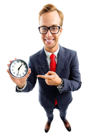 Full body portrait of funny happy businessman in glasses showing clock, confident suit and red tie, top angle view shot, isolated over white background. Business and time concept.