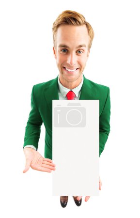 Photo for Full body portrait of funny young businessman in green confident suit and red tie, showing blank signboard with copyspace area for advertising text or slogan, top angle view shot, isolated over white background. Business concept. - Royalty Free Image