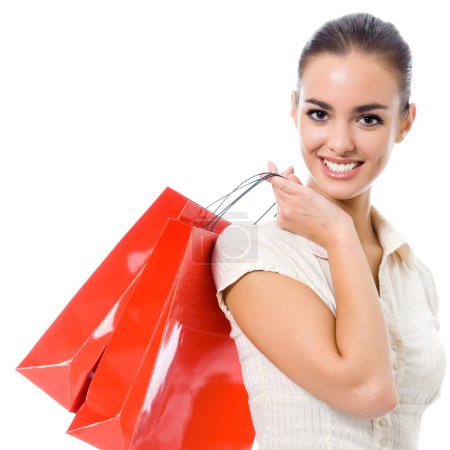 Photo for Portrait of young happy smiling woman with shopping bags, isolated over white background - Royalty Free Image
