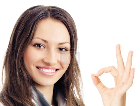 Happy smiling young female doctor with okay gesture, isolated over white background