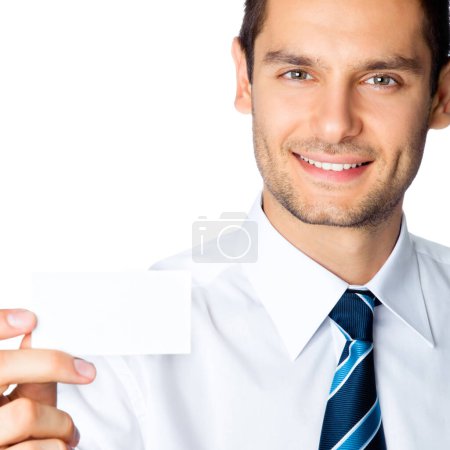 Foto de Feliz joven hombre de negocios sonriente mostrando negocio en blanco, plástico, tarjeta de crédito o letrero, aislado sobre fondo blanco - Imagen libre de derechos