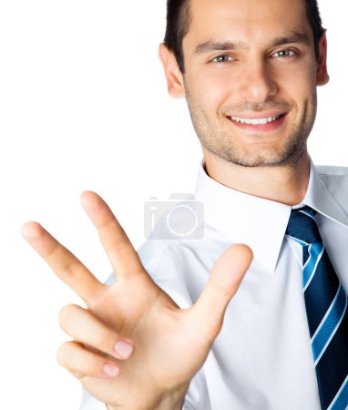 Foto de Retrato de feliz hombre de negocios sonriente mostrando tres dedos, aislado sobre fondo blanco - Imagen libre de derechos