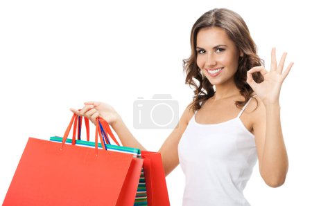 Foto de Feliz mujer sonriente con bolsas de compras, aislado sobre fondo blanco - Imagen libre de derechos