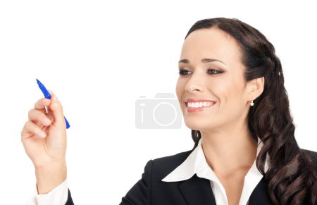 Photo for Happy smiling cheerful beautiful businesswoman writing or drawing something on screen or transparent glass, by blue marker, isolated against white background - Royalty Free Image