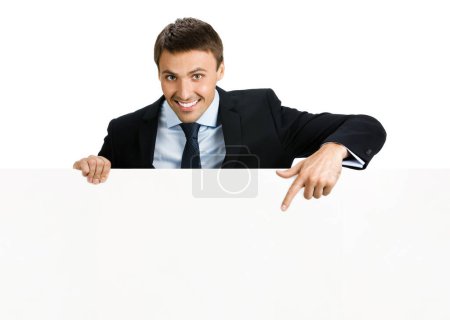 Photo for Happy smiling young businessman showing blank signboard, isolated against white background - Royalty Free Image