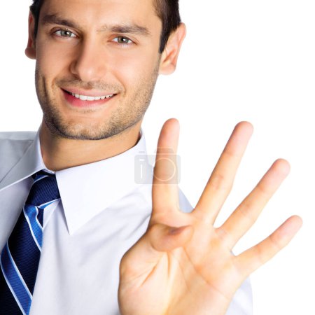 Foto de Feliz hombre de negocios sonriente mostrando cuatro dedos, aislado sobre fondo blanco - Imagen libre de derechos