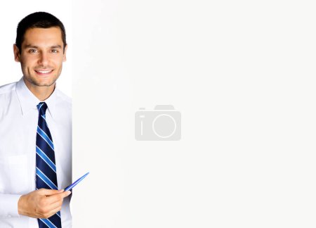 Photo for Happy smiling businessman showing blank signboard with copyspace for some text, advertising or slogan, isolated against white background - Royalty Free Image