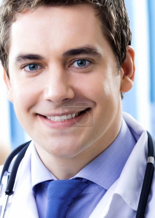 Photo for Portrait of happy smiling doctor at office - Royalty Free Image