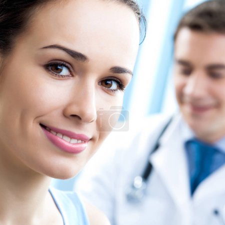Photo for Portrait of cheerful smiling male doctor and female patient - Royalty Free Image