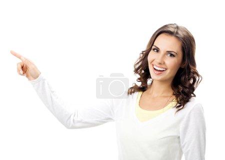 Photo for Happy smiling young woman showing something or empty place for some text, slogan, advertisement or copyspace, isolated against white background - Royalty Free Image